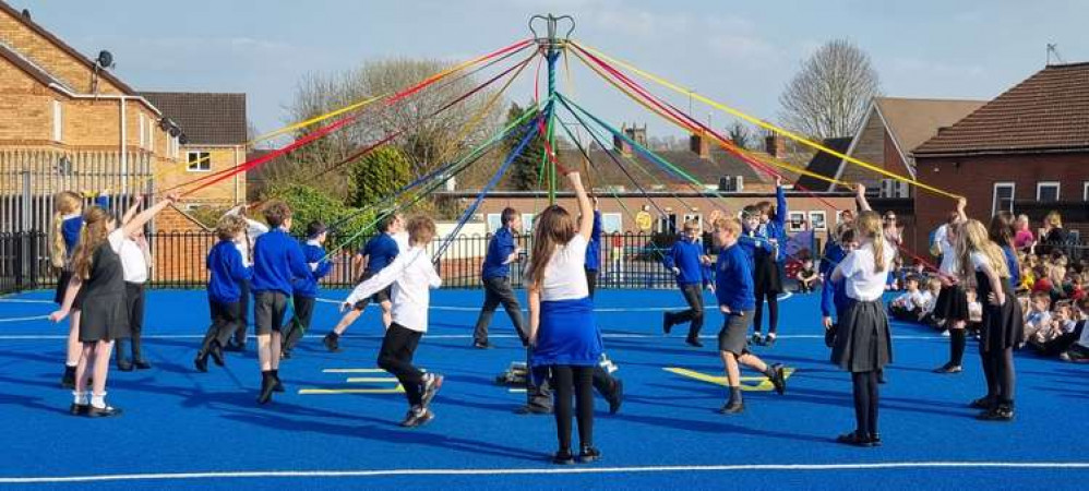 Pupils from Ashby C of E School dance around the Maypole. Photos: Ashby Church of England School