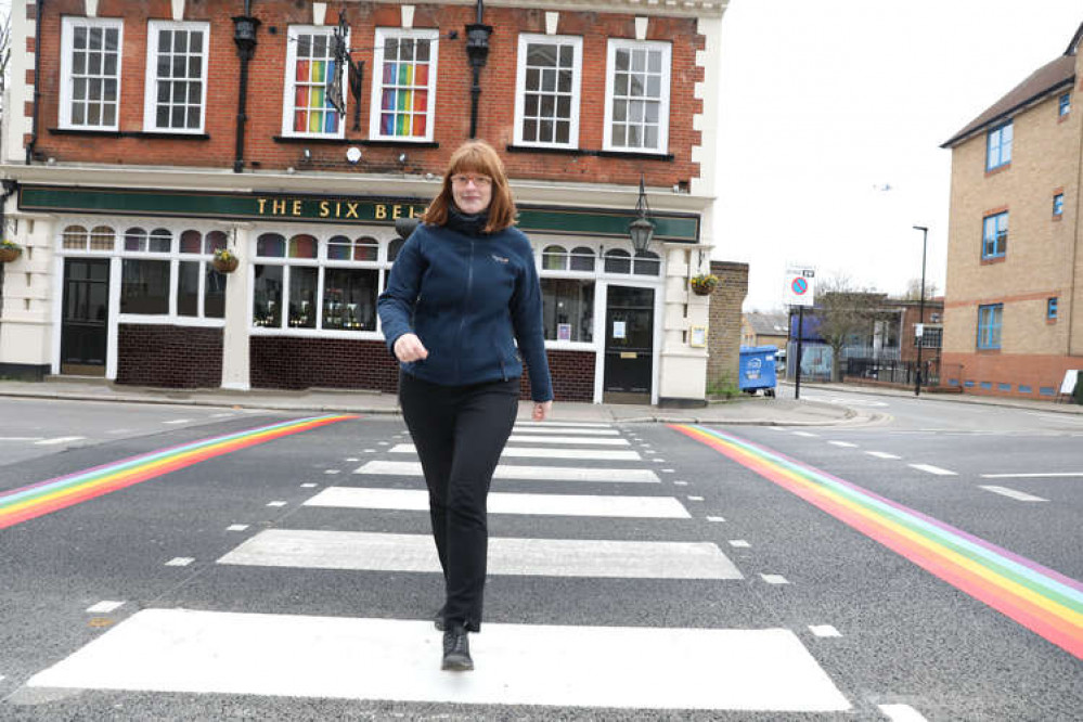 Councillor Katherine Dunne on the rainbow crossing with the Six Bells pub in the background.