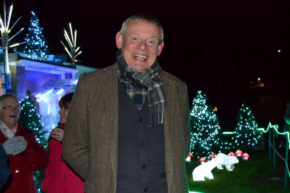 Martin Clunes turned on the Christmas lights at Monica and Rob Teague's home in Bradpole