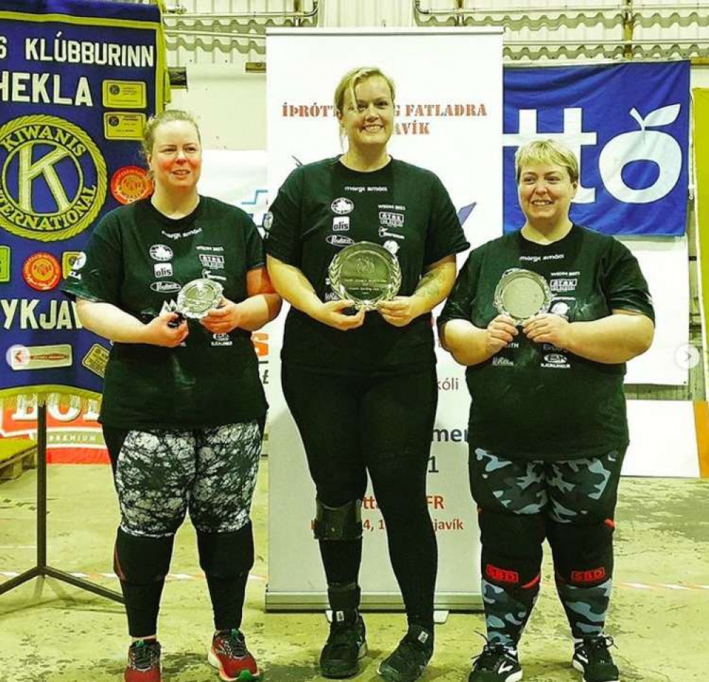 Bridport resident Lucy Beasley, pictured centre, named World's Strongest Disabled Woman