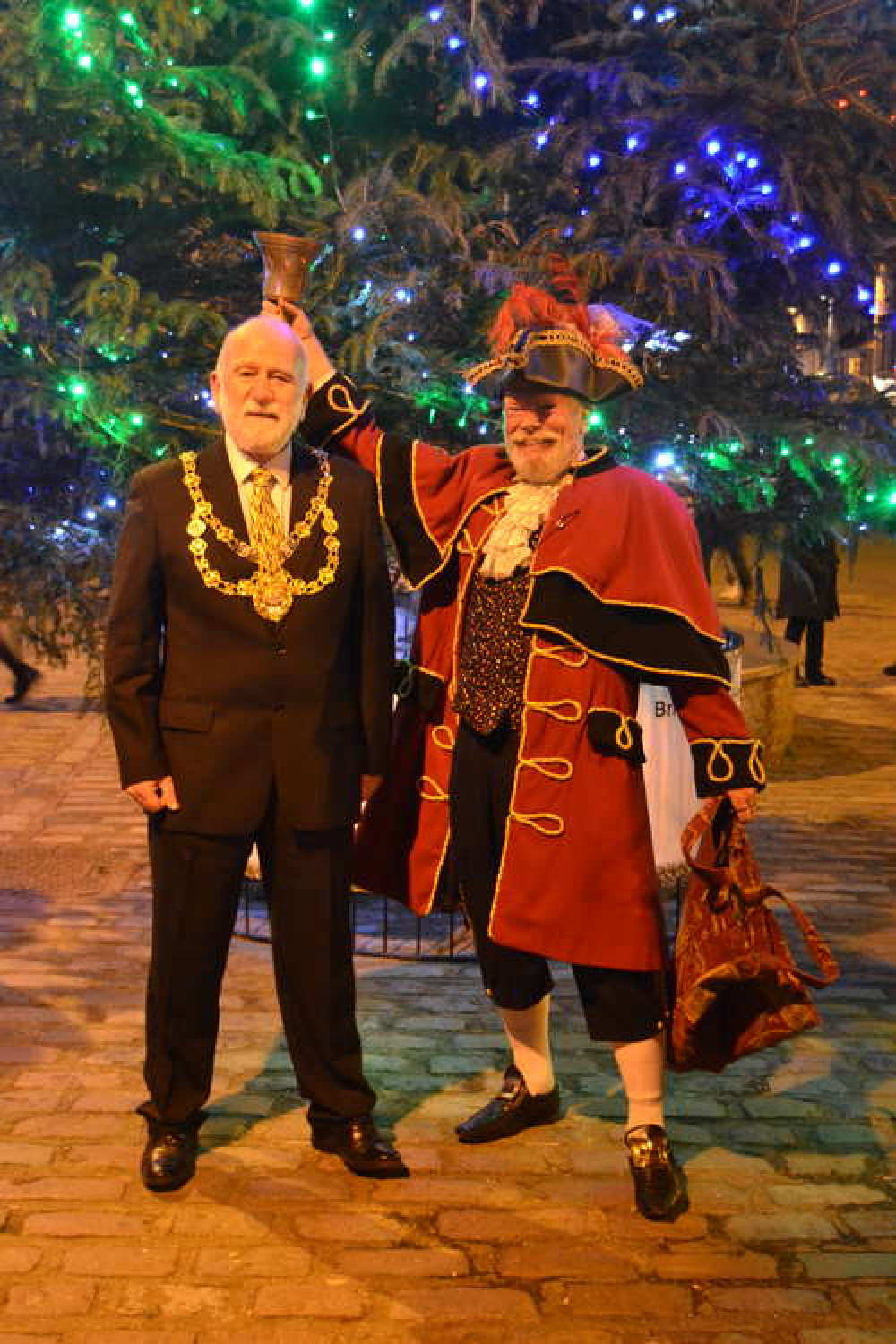 Bridport mayor, councillor Ian Bark, switches on the Christmas tree lights, pictured left with town crier John Collingwood