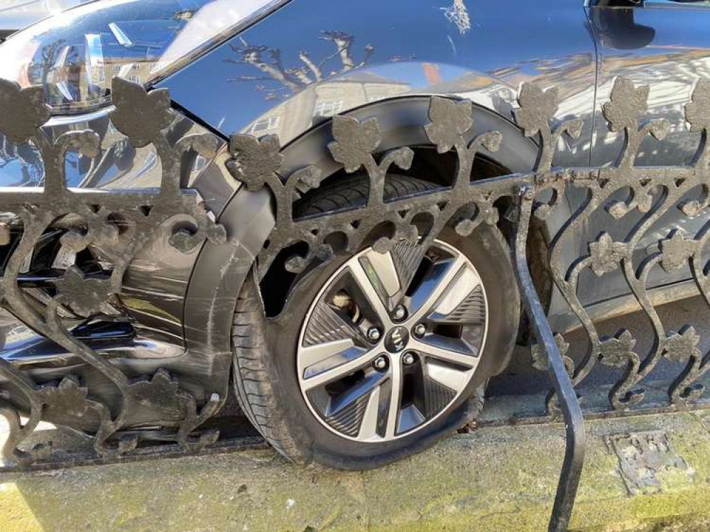 A car has crashed into railings in Bridport's West Street