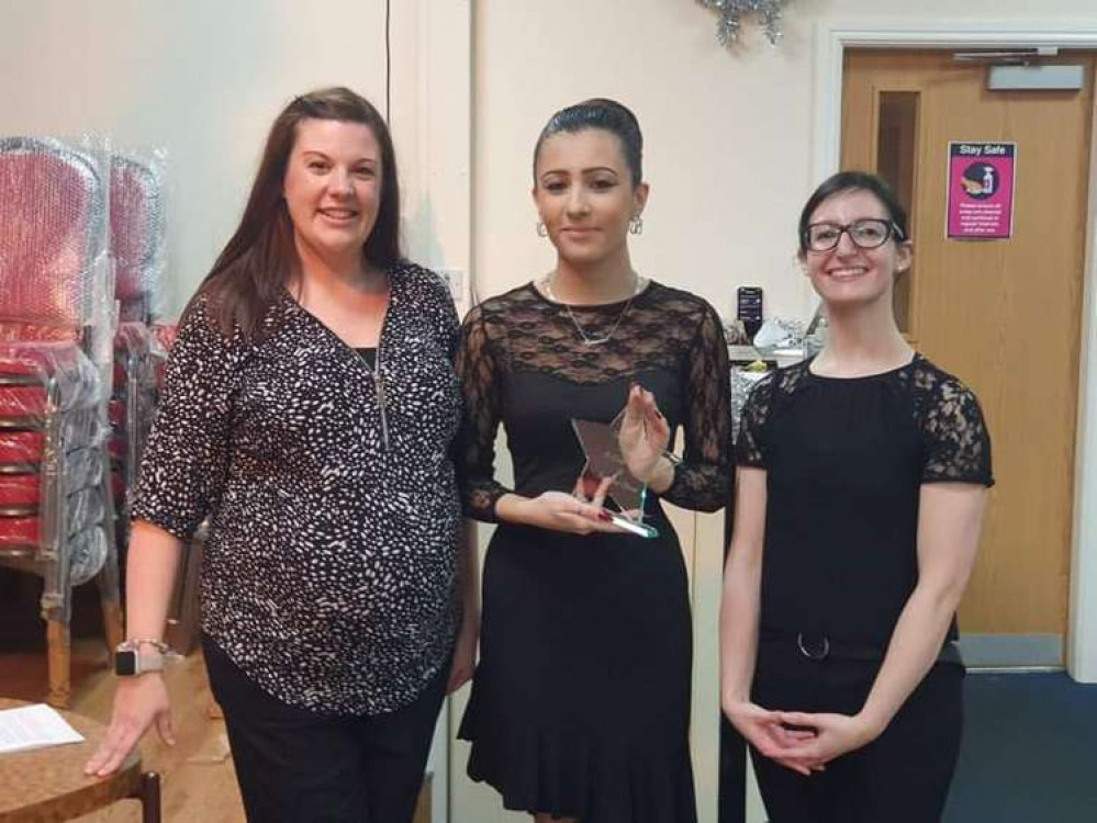 Kirsty (left) and Mandy presenting Tianna (centre) with her award