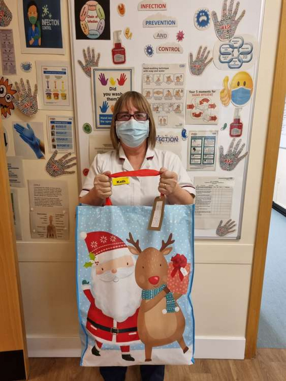 Kath Jessop from Coalville Community Hospital with a sack of presents