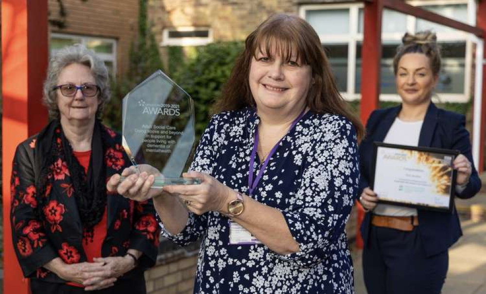 Councillor Christine Radford, county council cabinet member for adult social care, along with Olivea Allegrini-Jones, Inspired to Care's Workforce Lead, presenting the award to Chris Smalley