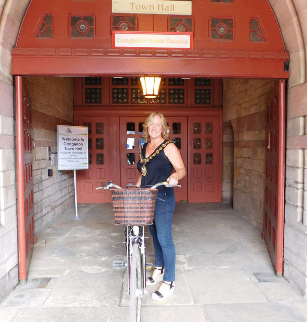 Suzie with her bike outside Congleton Town Hall.