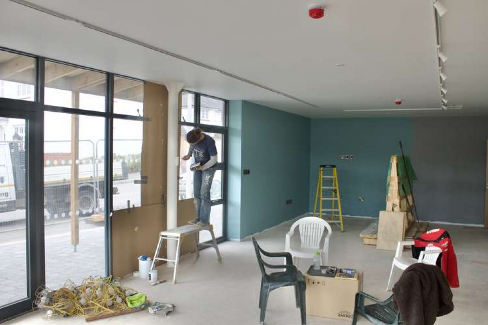 Tracy German painting in the cafe area (Nub News, Will Goddard)