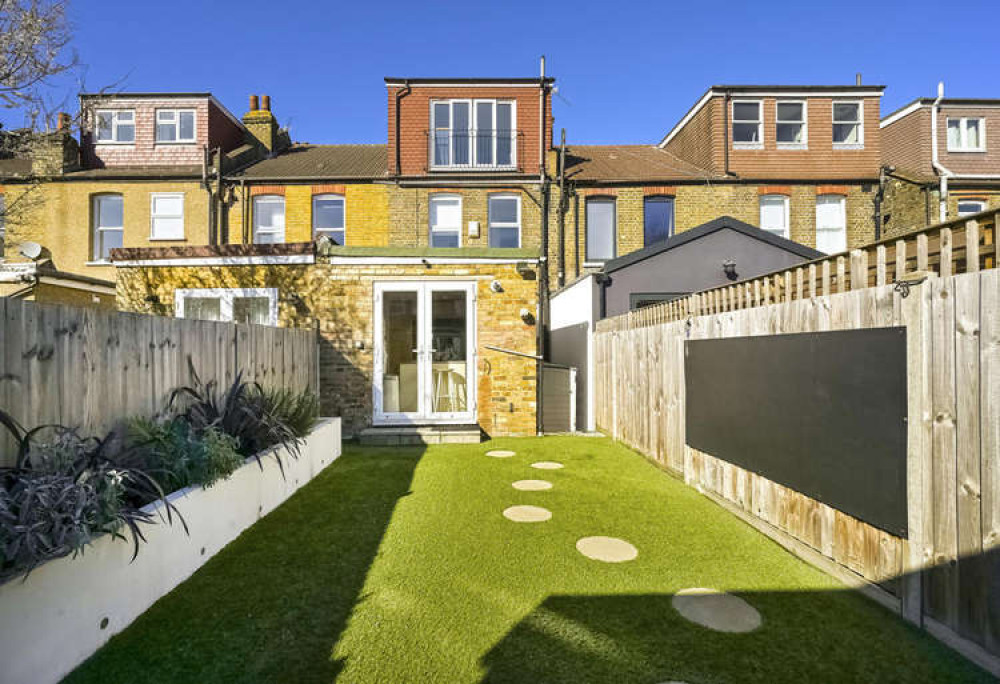 A wonderful sense of flow between indoor and outdoor spaces is fostered with the kitchen leading onto a sizable south-facing garden (Image: Leslie & Co)