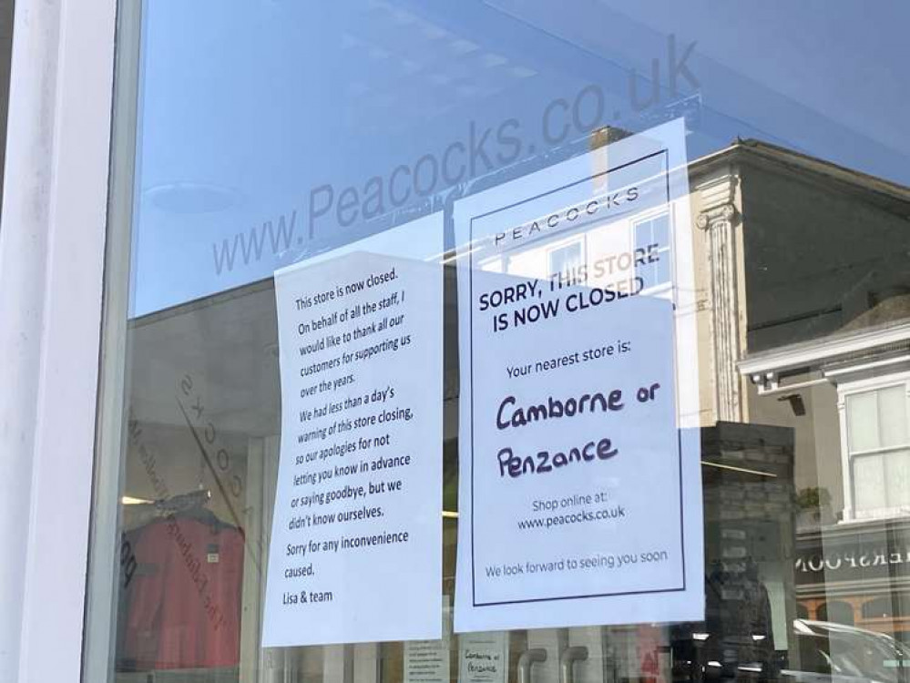 A notice left on the window of the Peacocks store.