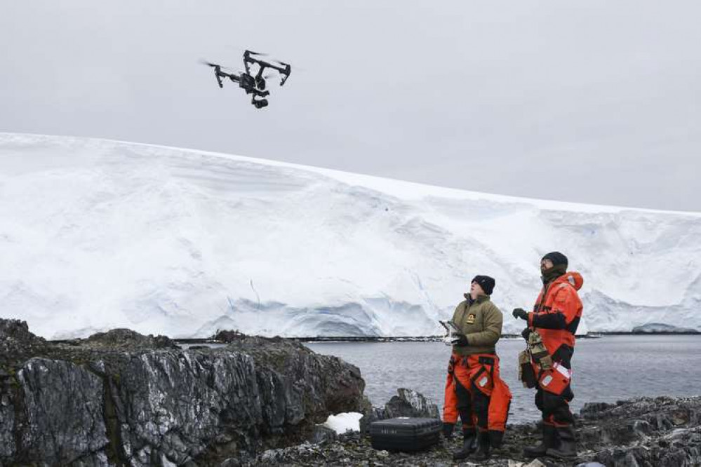 Pictures of the drone experts in Antarctica. Credit: Royal Navy.