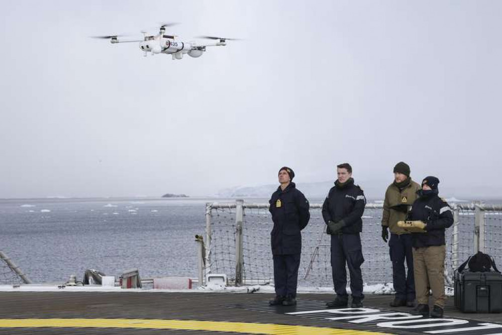 Pictures of the drone experts in Antarctica. Credit: Royal Navy.