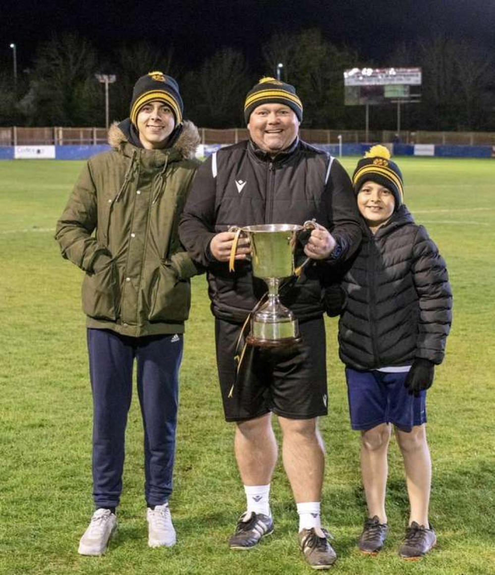 Stotfold FC family: Proud dad Paul Donnelly shares trophy joy with his two sons. CREDIT: Stotfold FC