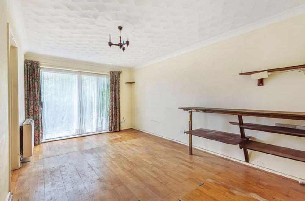 The living room features patio doors opening out to the front of the property (Bradleys)