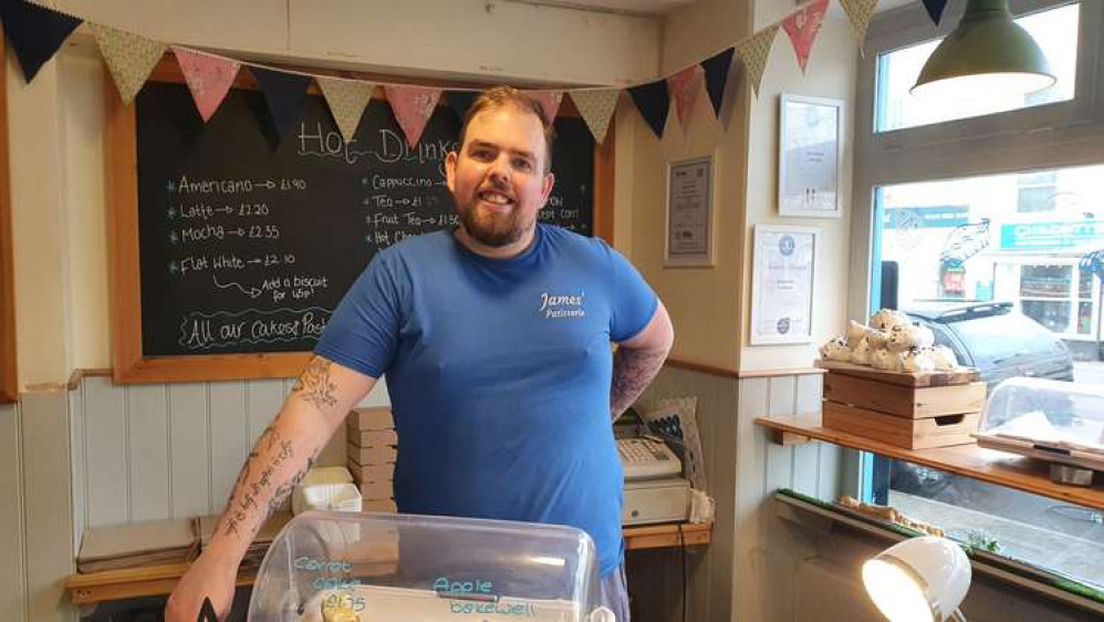 James inside his shop, James' Patisserie and Sandwiches