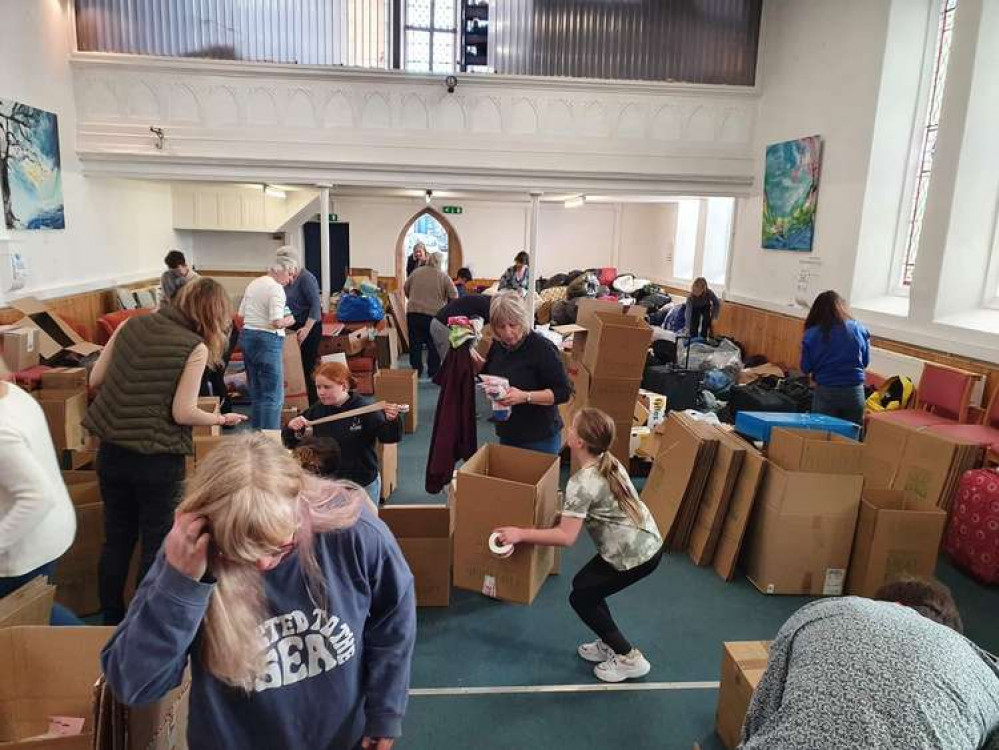 The volunteers sorting through the boxes.