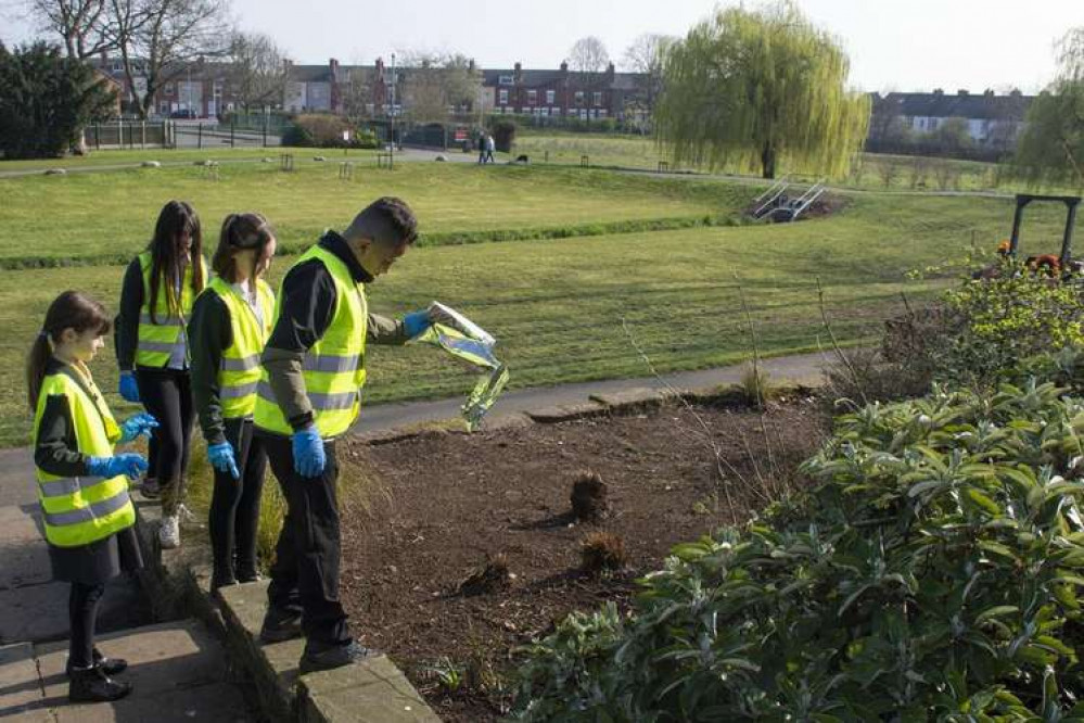 Students from Broomhill School (pictured) sowing wildflowers in Titchfield Park in Hucknall. Photo courtesy of Ashfield District Council.