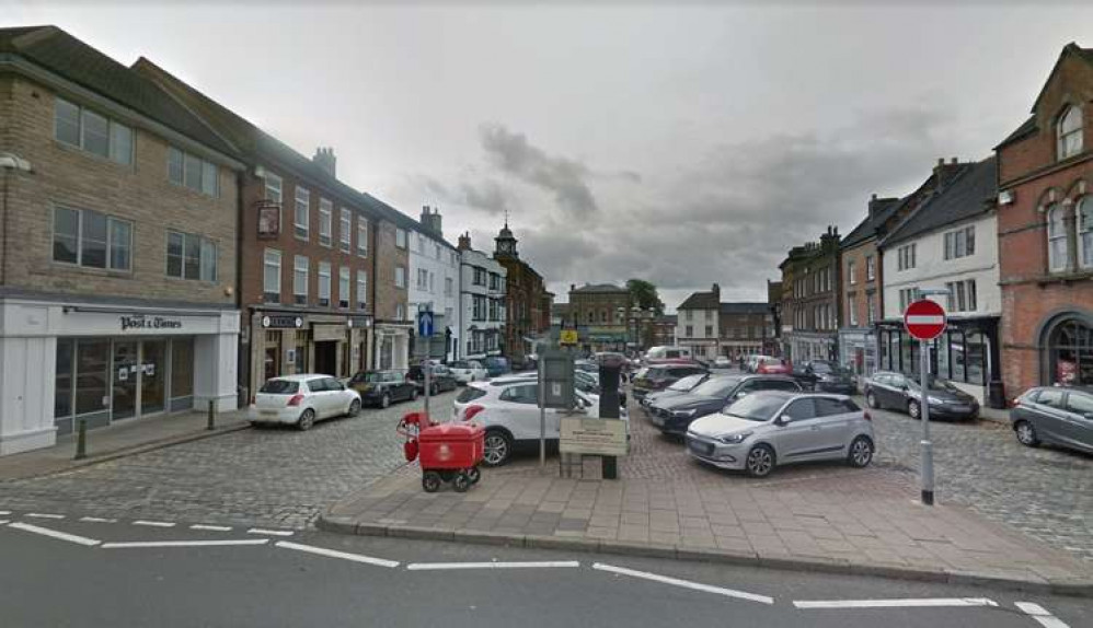 Cars parked at Market Place in Leek.