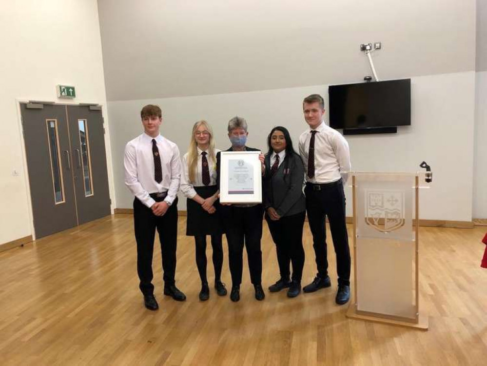 St Cyres School students with Jane Hutt MS receiving the School of Sanctuary recognition. (Image credit: Vale of Glamorgan Council)