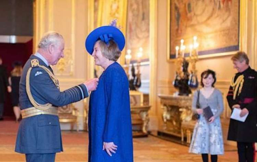 Former Chief Superintendent Sally Benatar receives the Queen's Police Medal from the Prince of Wales.