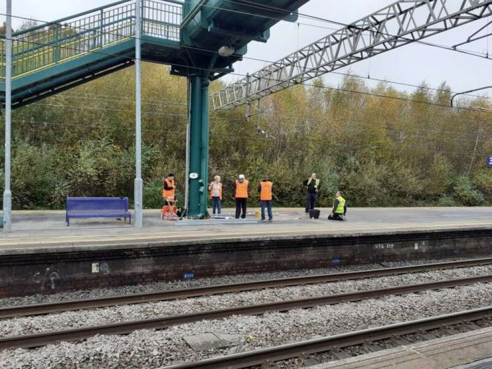 DSL and Friends of Sandbach Station installing the sign today