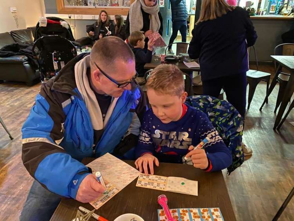 A player enjoys the bingo session at the Sandbach party for CPUFC