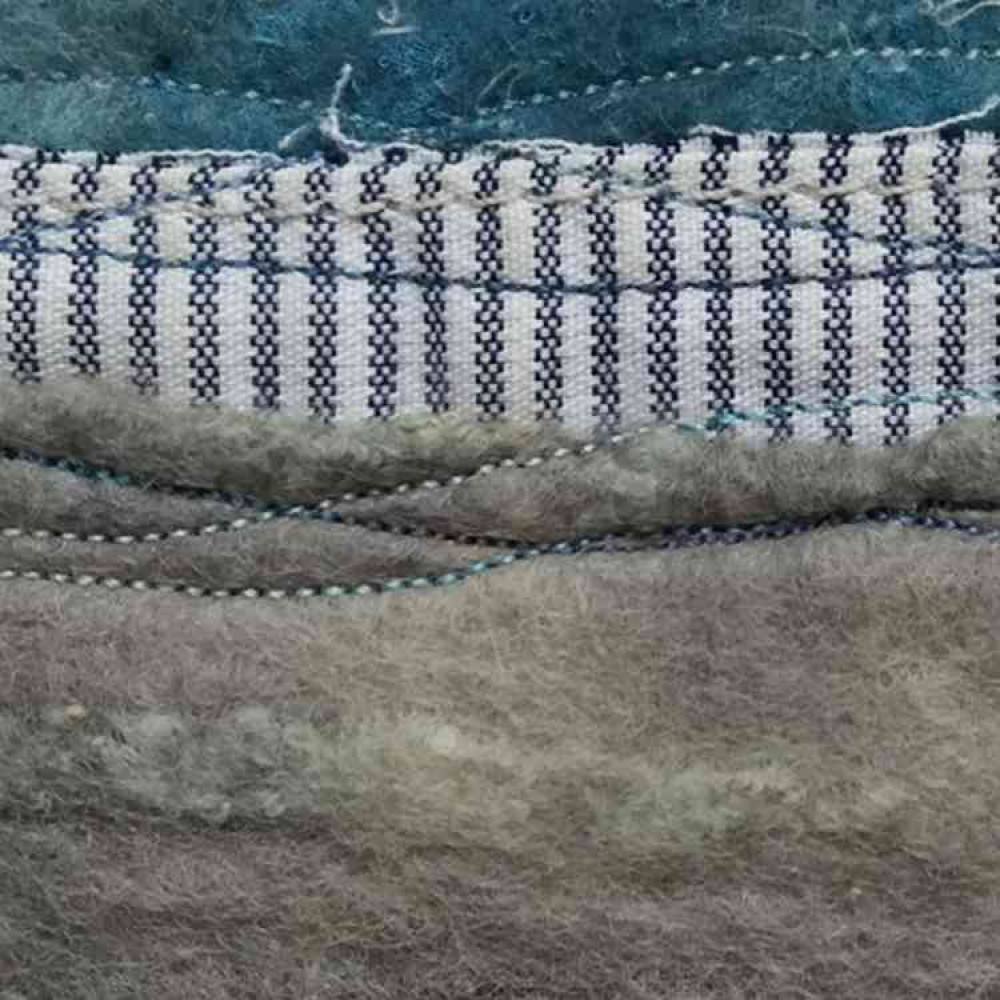 One of Sue's exhibition pieces, the stitched lines representing the movement of the wind. One of Sue's exhibition pieces, the stitched lines representing the movement of the wind.