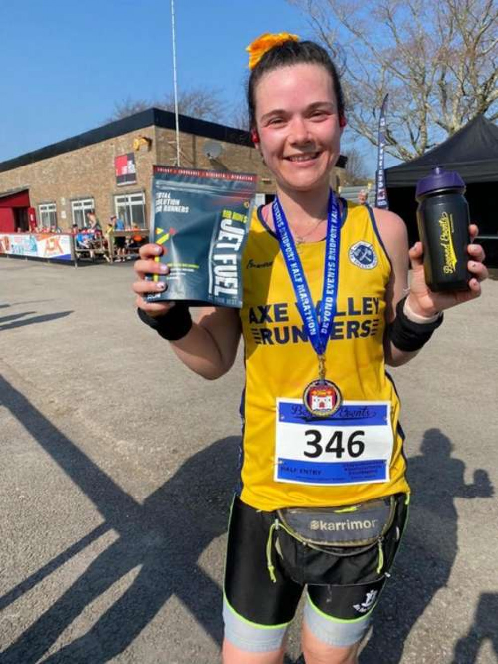 Axe Valley Runner Laura Kerr with her prizes for third female at Bridport Half Marathon