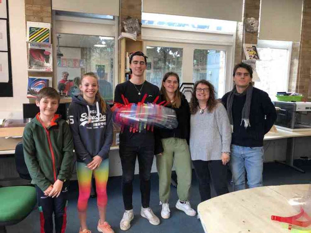 The Tucker and Baxter-Allen families help make masks in Millfield's D&T department The Tucker and Baxter-Allen families help make masks in Millfield's D&T department