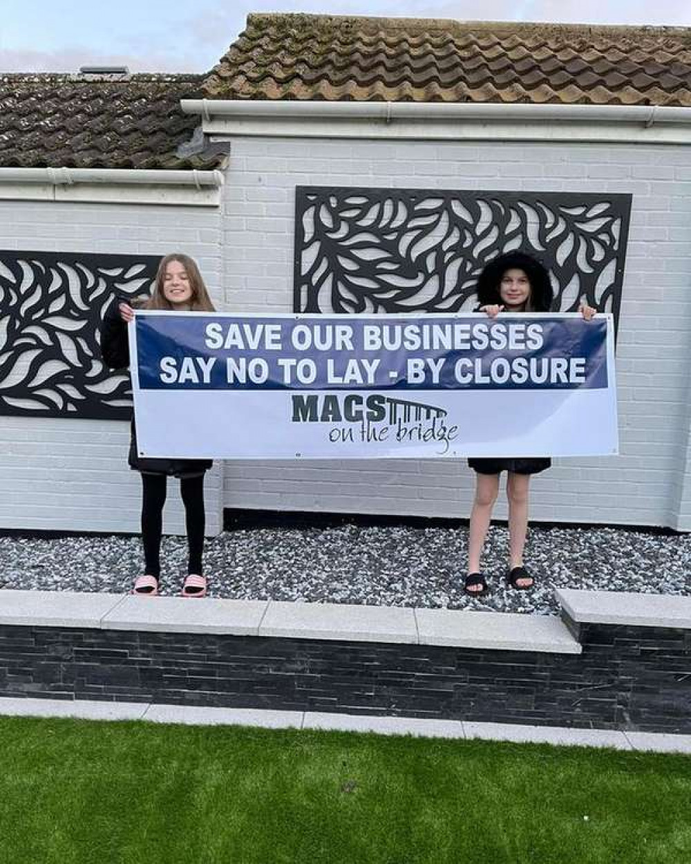 Nick and Sam's daughters backing the campaign (Picture credit: Macs on the Bridge)