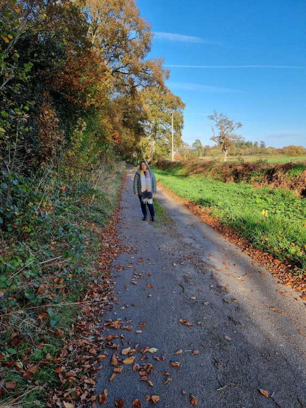 Councillor Jess Bailey stands on Birdcage lane, near the planned entrance to the new quarry. Credit: Jess Bailey