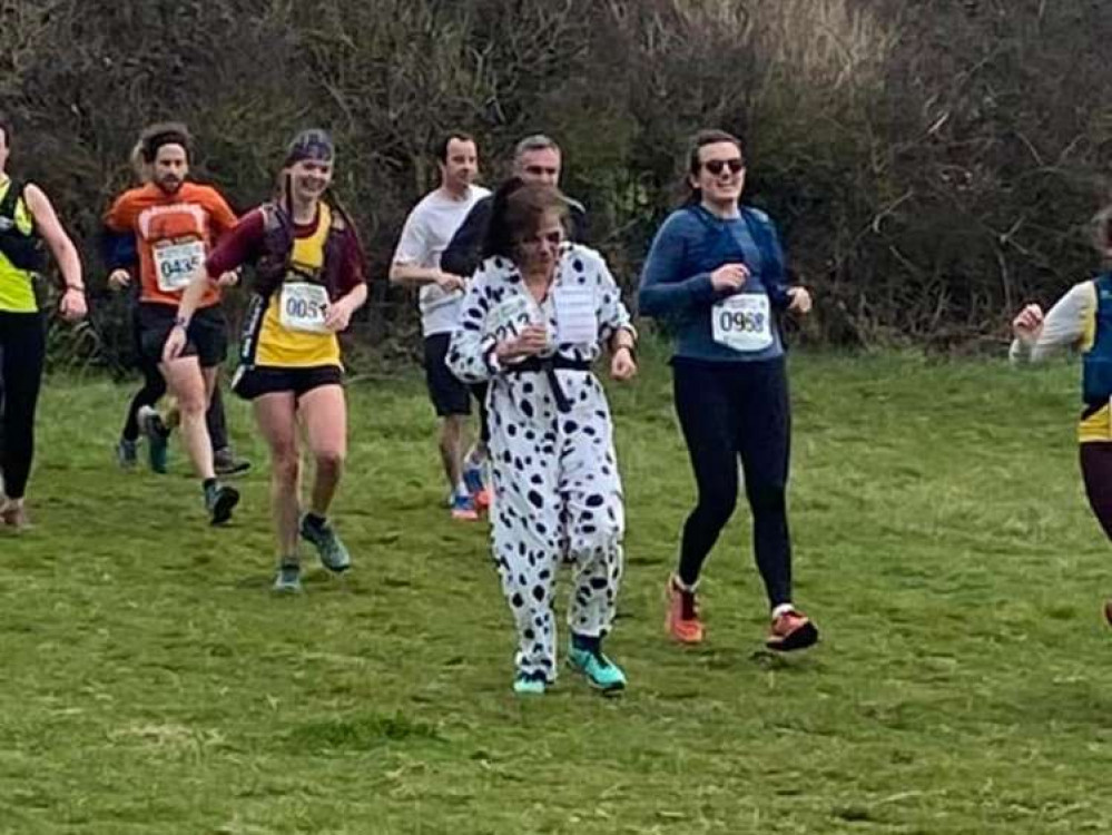 Naomi Garrick ran in a dog costume for charity.