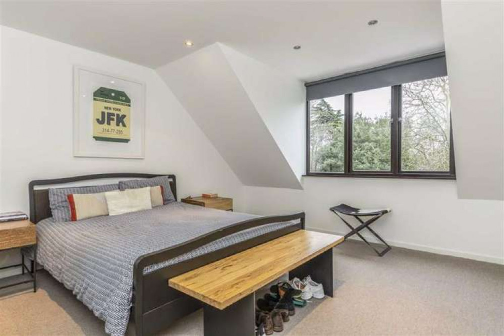 One of the bedrooms in the cosy flat - now on sale for £1.2 million (Image: Waterview)