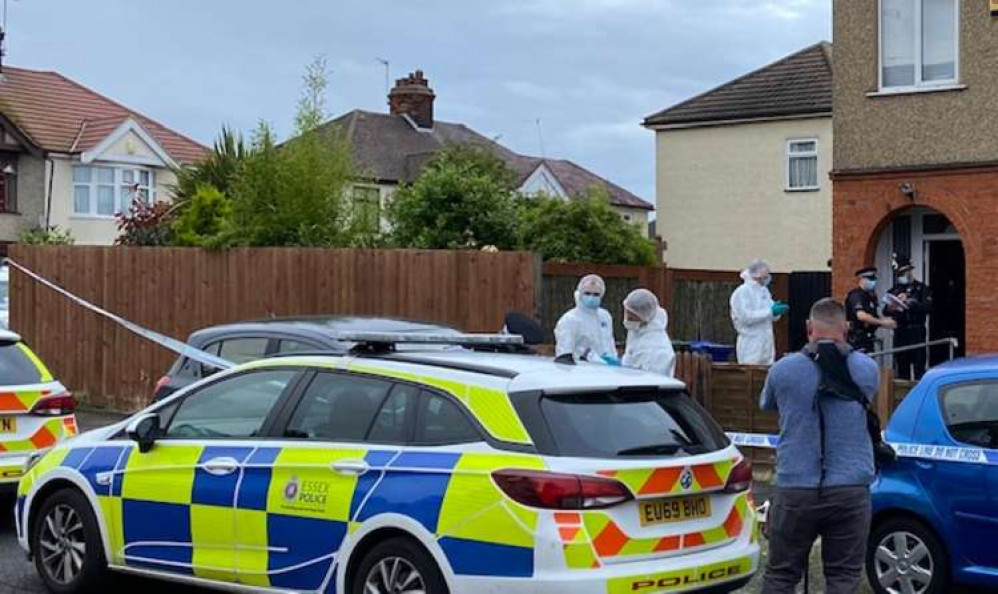 Forensic officers at the house on Lenmore avenue in June.