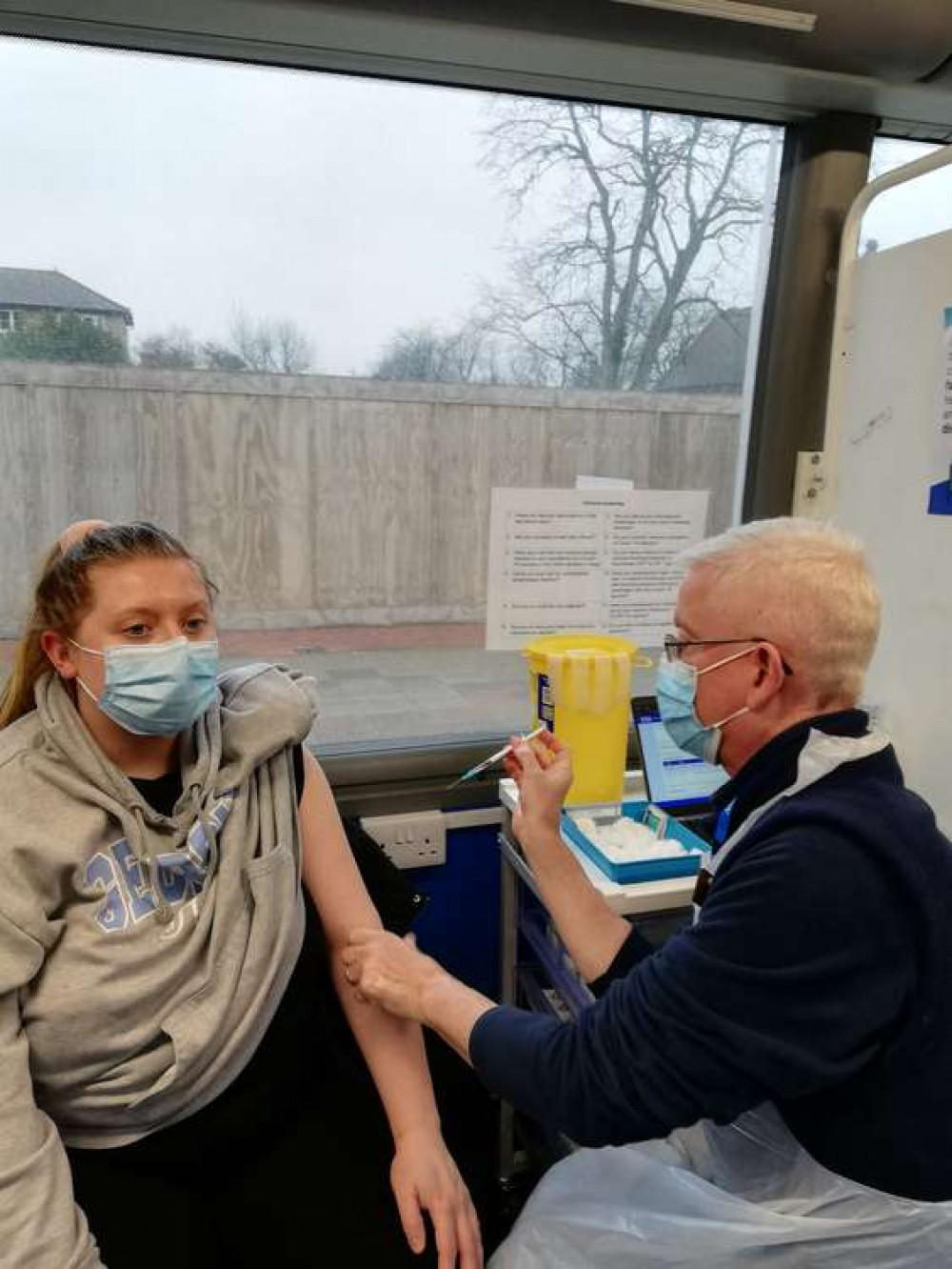 Megan-Louise Hanmore (left) received her second dose of the COVID-19 vaccine at the vaccination bus when it was parked outside South Essex College in Grays.