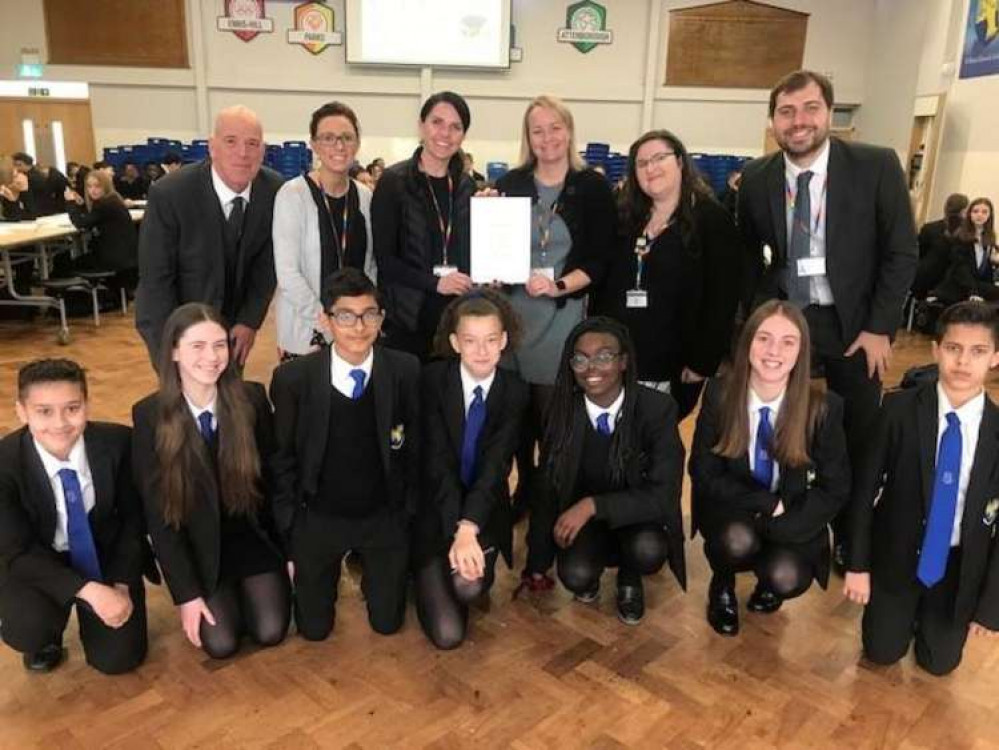 Pupils and staff with the award.