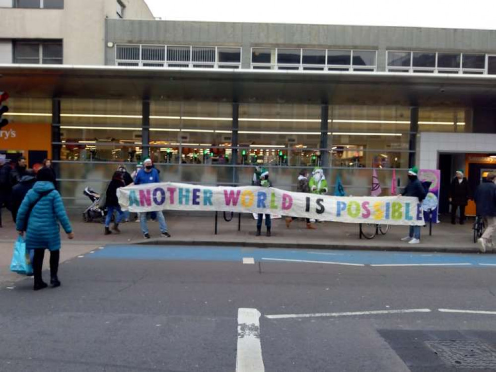 A banner proclaims 'Another World Is Possible'