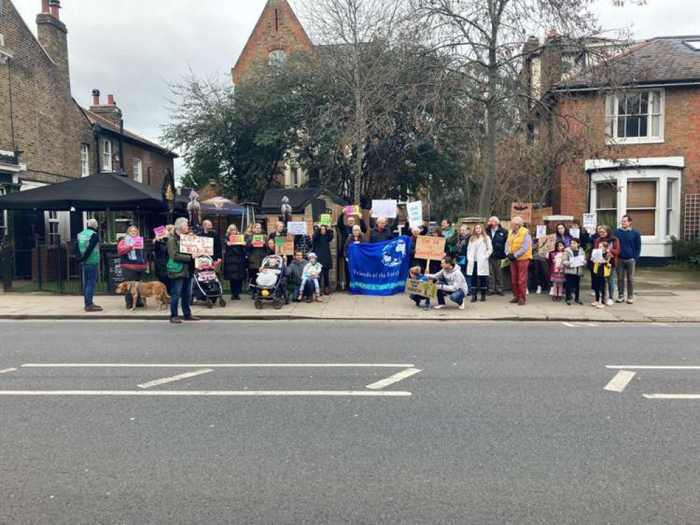 More than 40 people gave up their Bank Holiday to fight a developer's plans to fell trees close to Twickenham Green. More than 40 people gave up their Bank Holiday to fight a developer's plans to fell trees close to Twickenham Green.