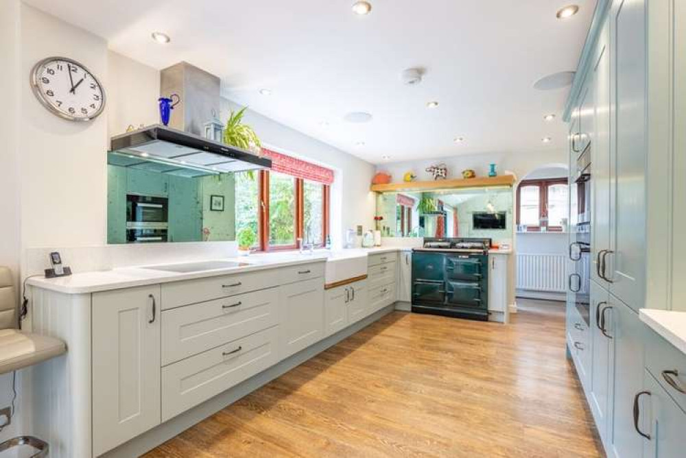 A stunning kitchen includes a gas fired Aga