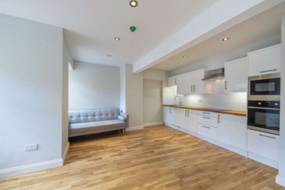 The living room and kitchen is bright and modern The living room and kitchen is bright and modern