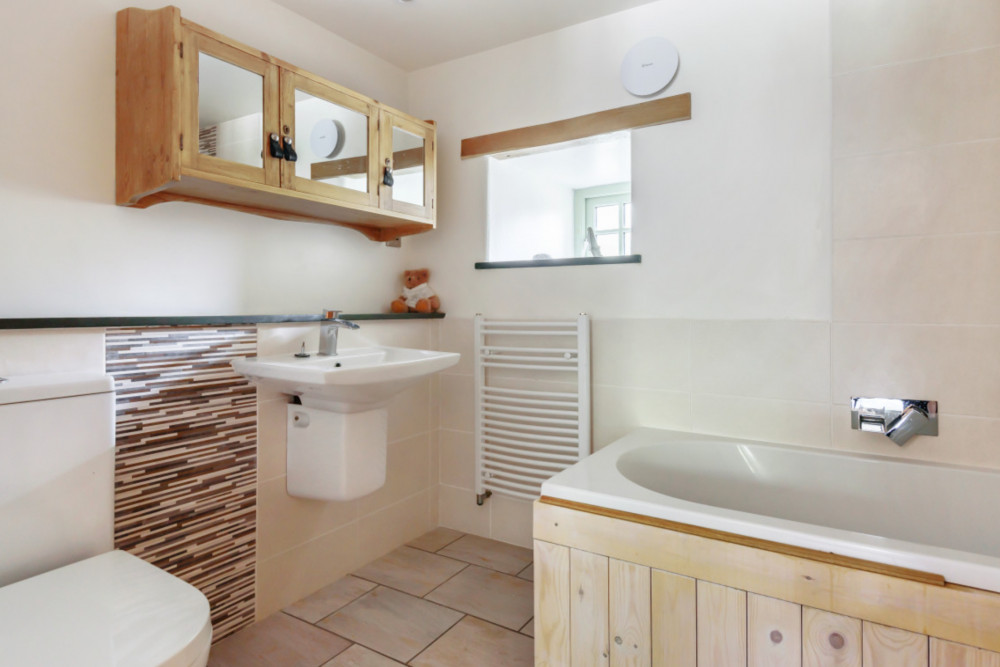 The bathroom. See this three bed property in Sithney. 