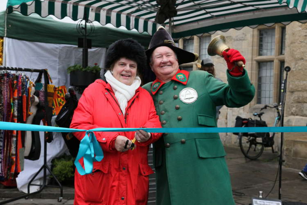 Cllr Ros Wyke, Leader of Mendip District Council and Len Sweales, Wells Town Crier declaring 'Christmas in Wells' open at the ribbon cutting ceremony. Cllr Ros Wyke, Leader of Mendip District Council and Len Sweales, Wells Town Crier declaring 'Christmas in Wells' open at the ribbon cutting ceremony.