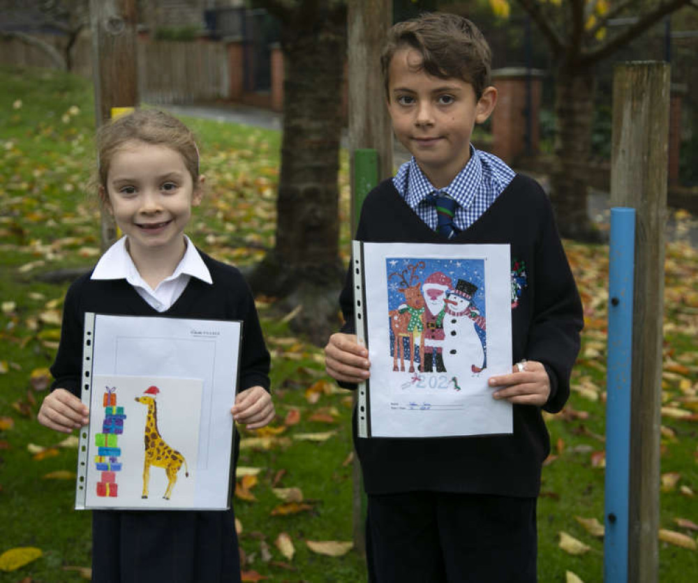 Competition winners Emily and Sebbie with their winning designs Competition winners Emily and Sebbie with their winning designs