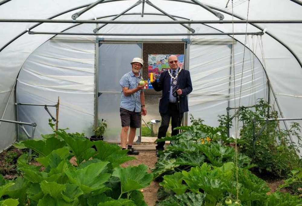 Wilmslow Town Council Chairman, Martin Watkins, with Transition Wilmslow's Andrew Backhouse at the Oakenclough Community Market Garden.