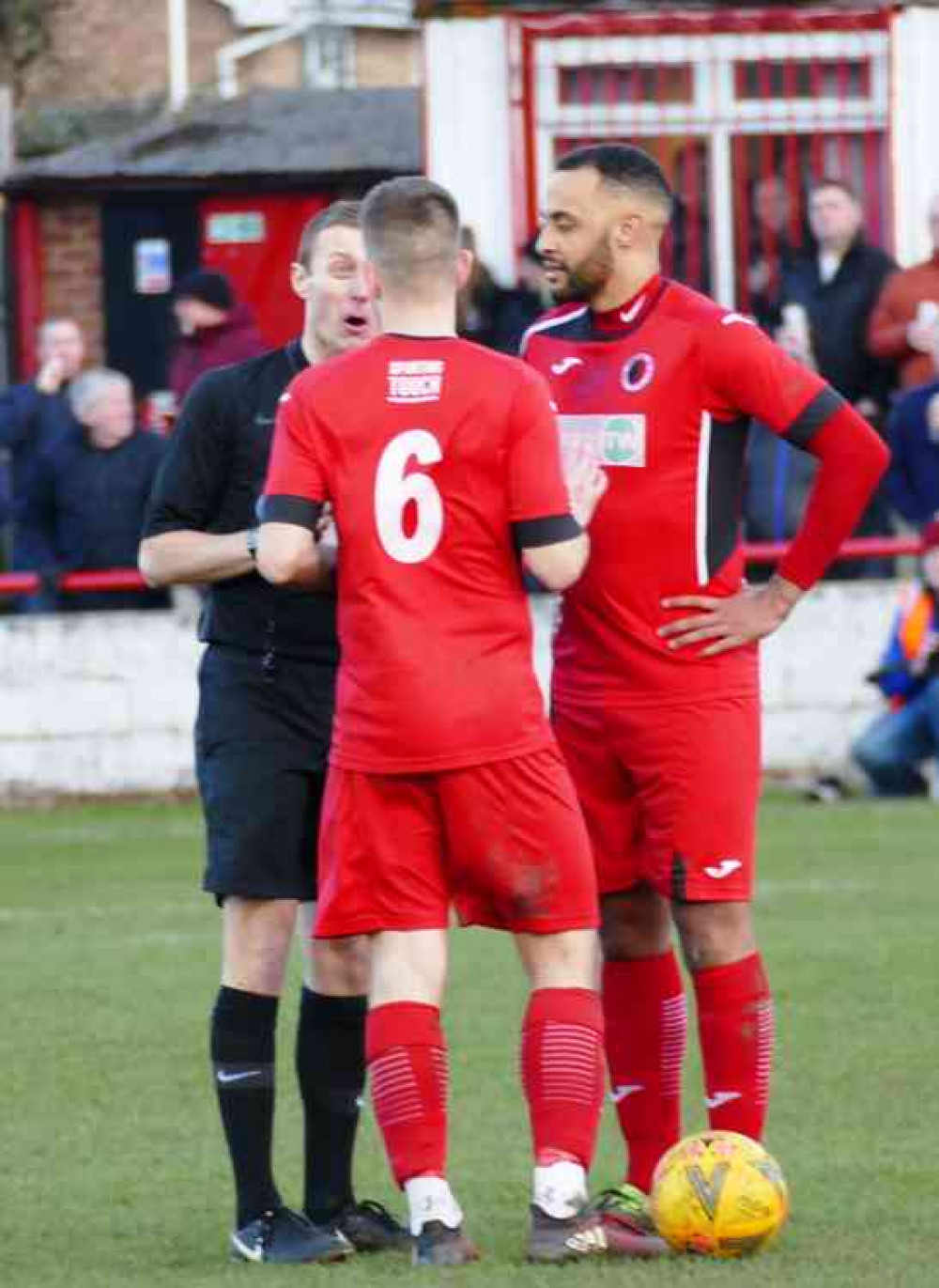 More chatter: Aaron Bannister makes a point to Adders duo Scott Goodby and Joe Obi