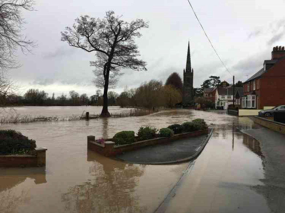 Down by the riverside: Witherley this afternoon as the River Anker bursts its banks