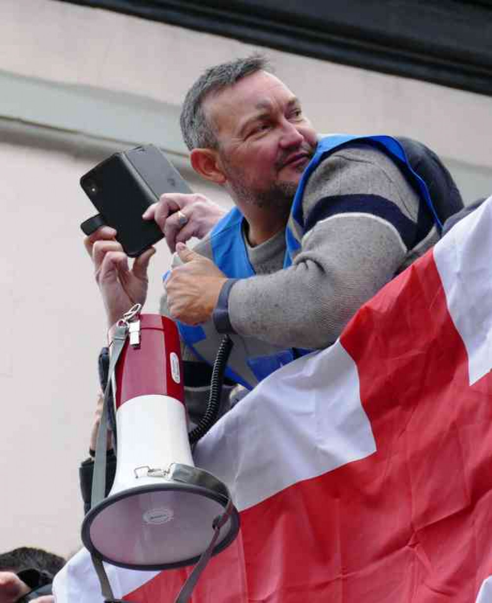 Megaphone at the ready: Chairman Rob Bernard waiting to launch his first ball game