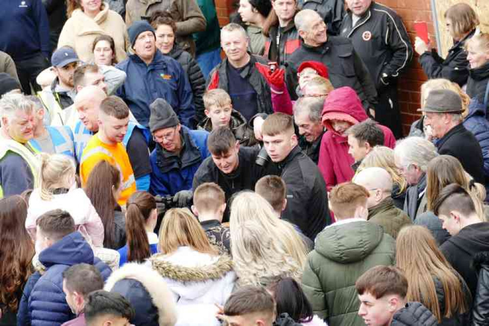 A snapper 'snapped': Former Nuneaton Evening Tribune chief photographer Ted Cottrell (blue woolly hat) is caught on camera taking action shots