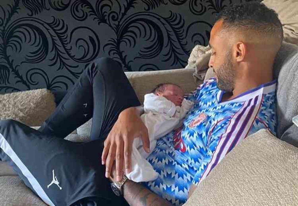 Back home: Joe Obi with new-born daughter Brroklyn