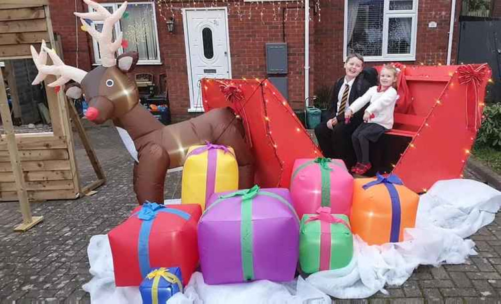 Lindzi and Dave Myers created Santa's Sleigh (from the Hillary Rise Christmas Lights Facebook page)