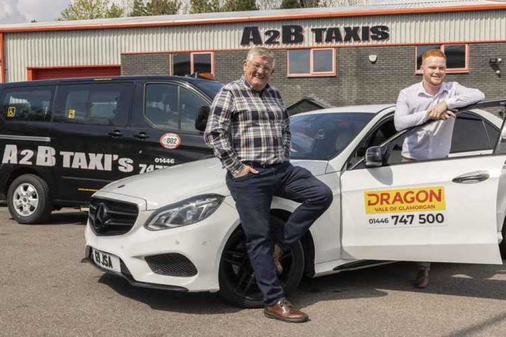 left to right, Mike Moore, MD, A2B Taxis, Barry with Jack Price, Regional Director, Dragon Taxis